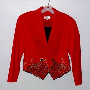 Solid red blazer with floral detail at the bottom